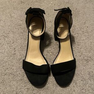 Plain black slightly fuzzy (supposed to be) heels